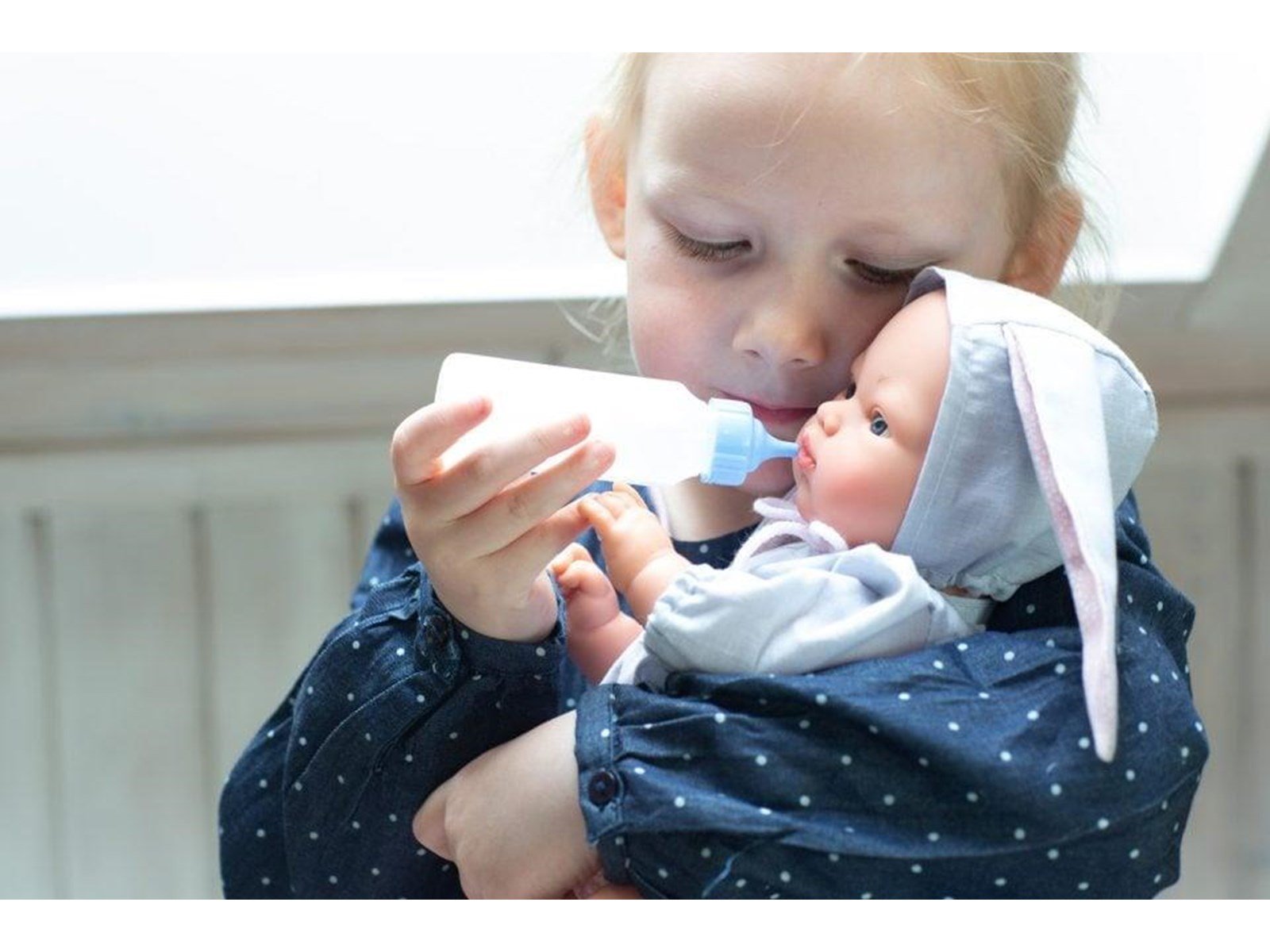 Asi Koke baby doll in gray dress with a hood with rabbit ears 36 cm