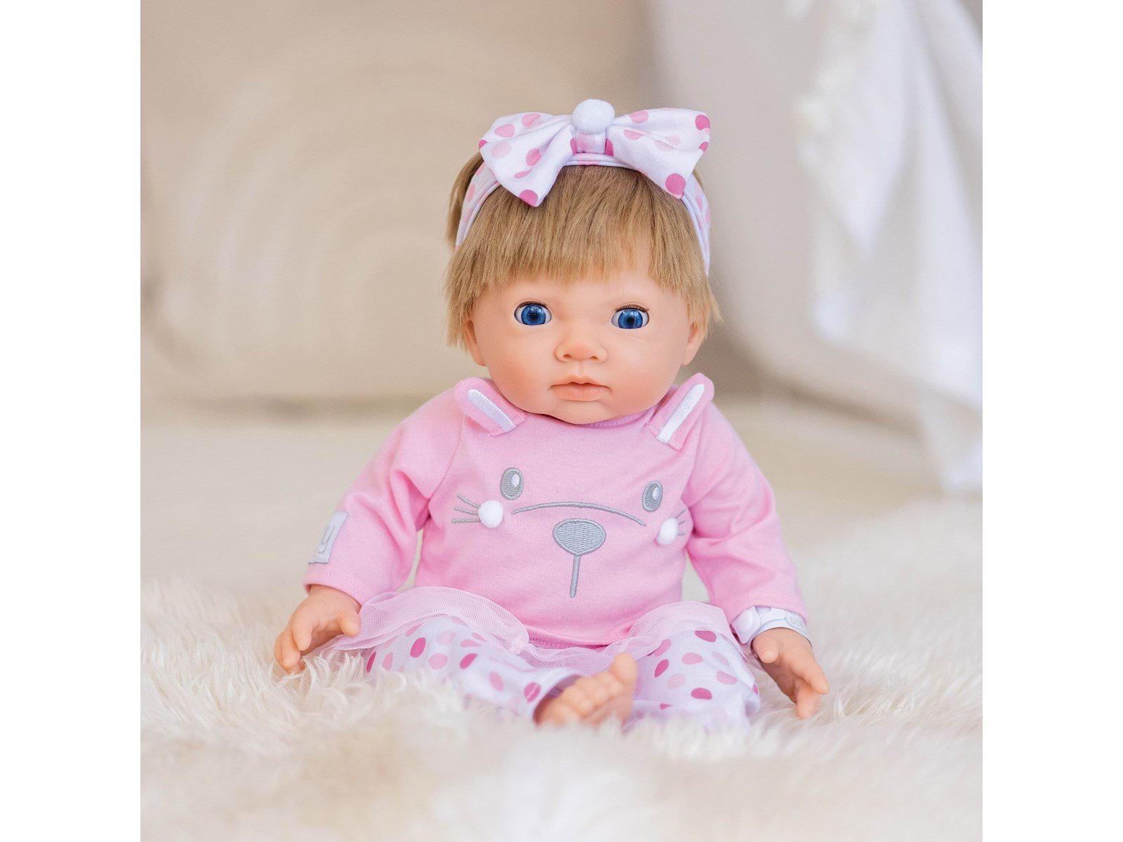 Tiny Treasures Doll with blonde hair and pink outfit