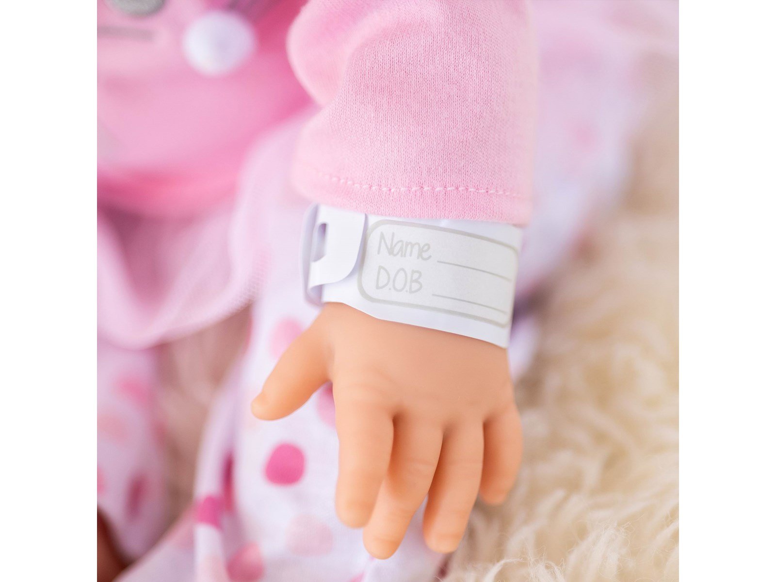Tiny Treasures Doll with blonde hair and pink outfit