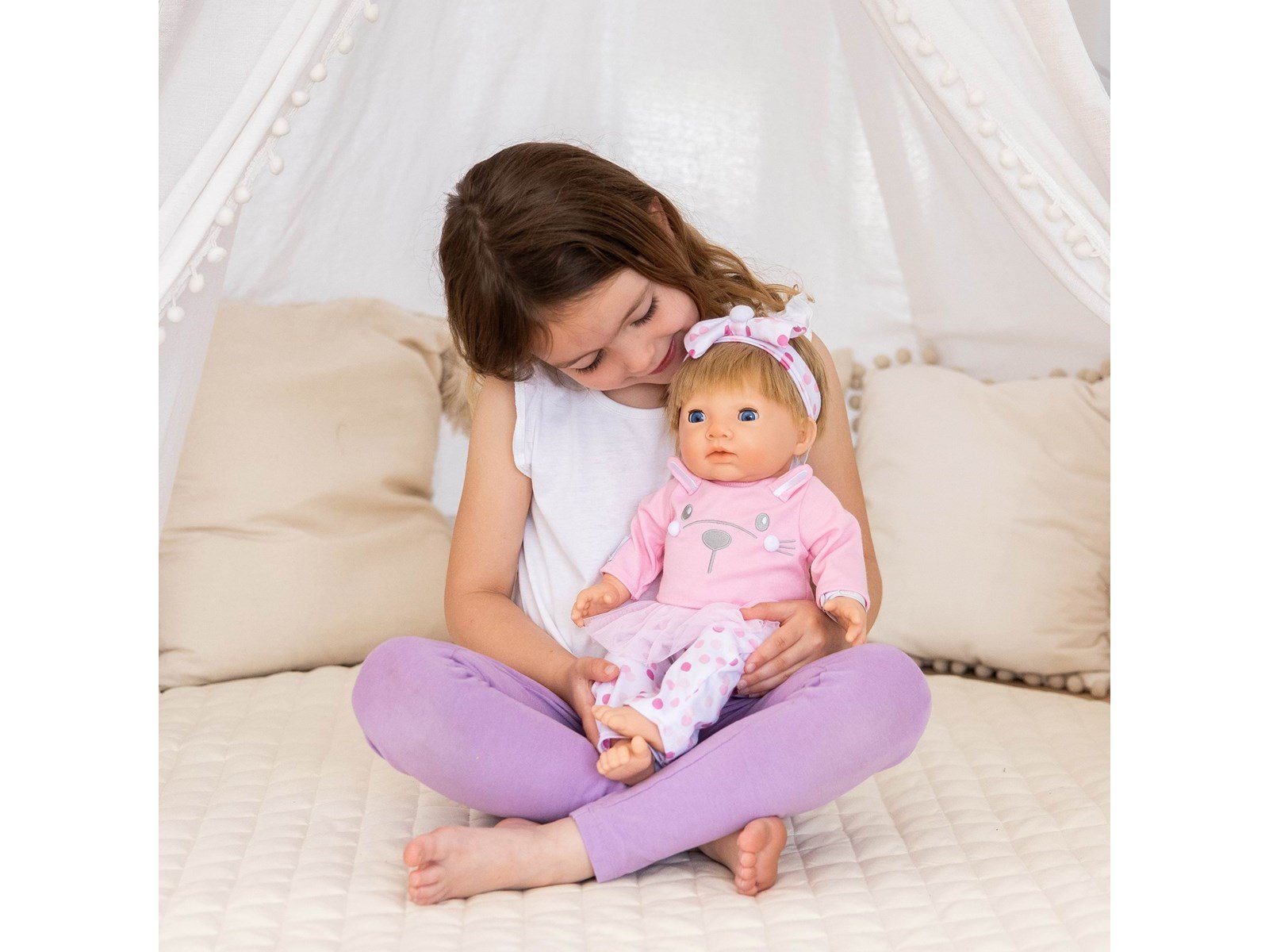 Tiny Treasures Doll with blonde hair and pink outfit