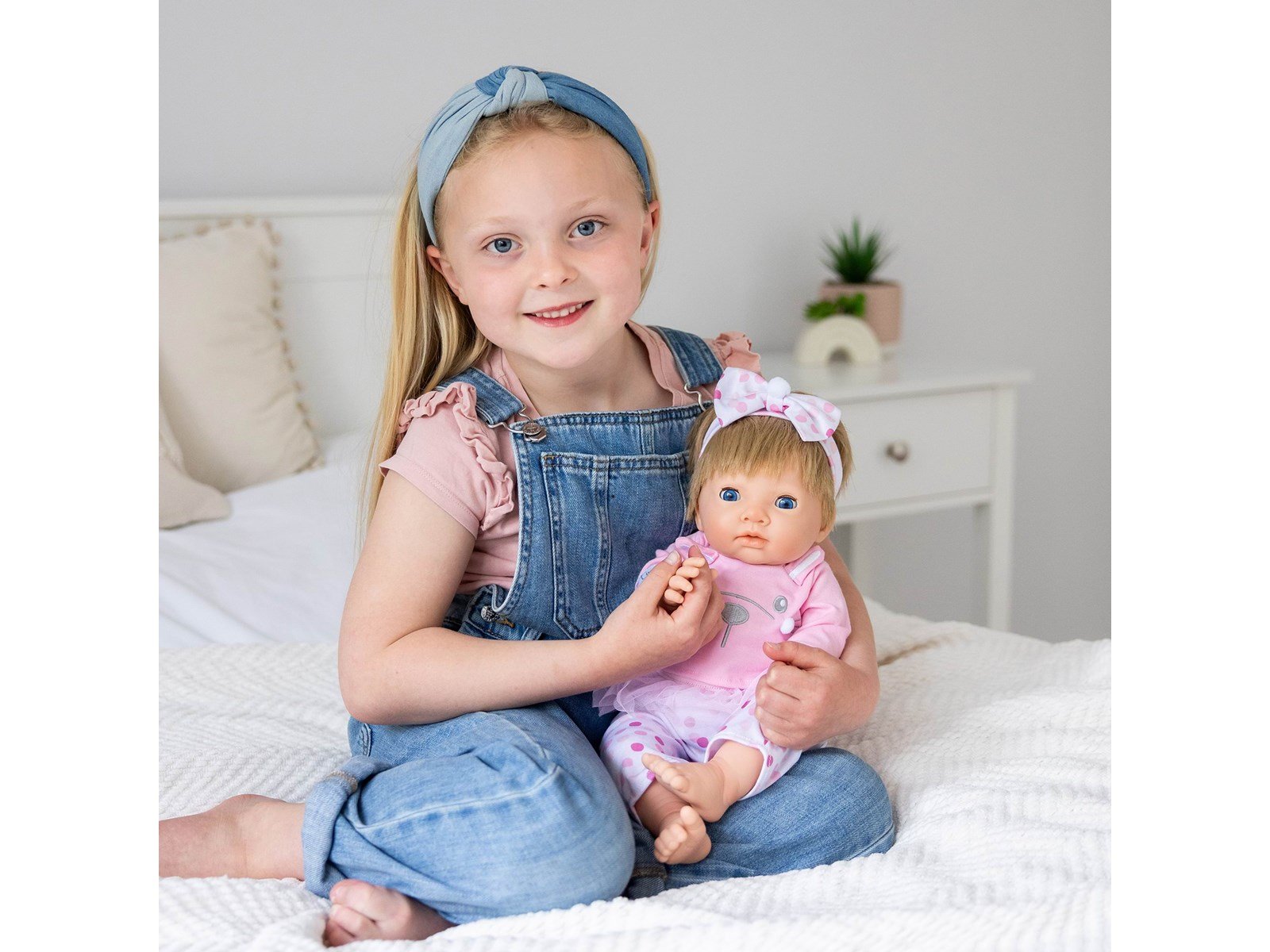 Tiny Treasures Doll with blonde hair and pink outfit