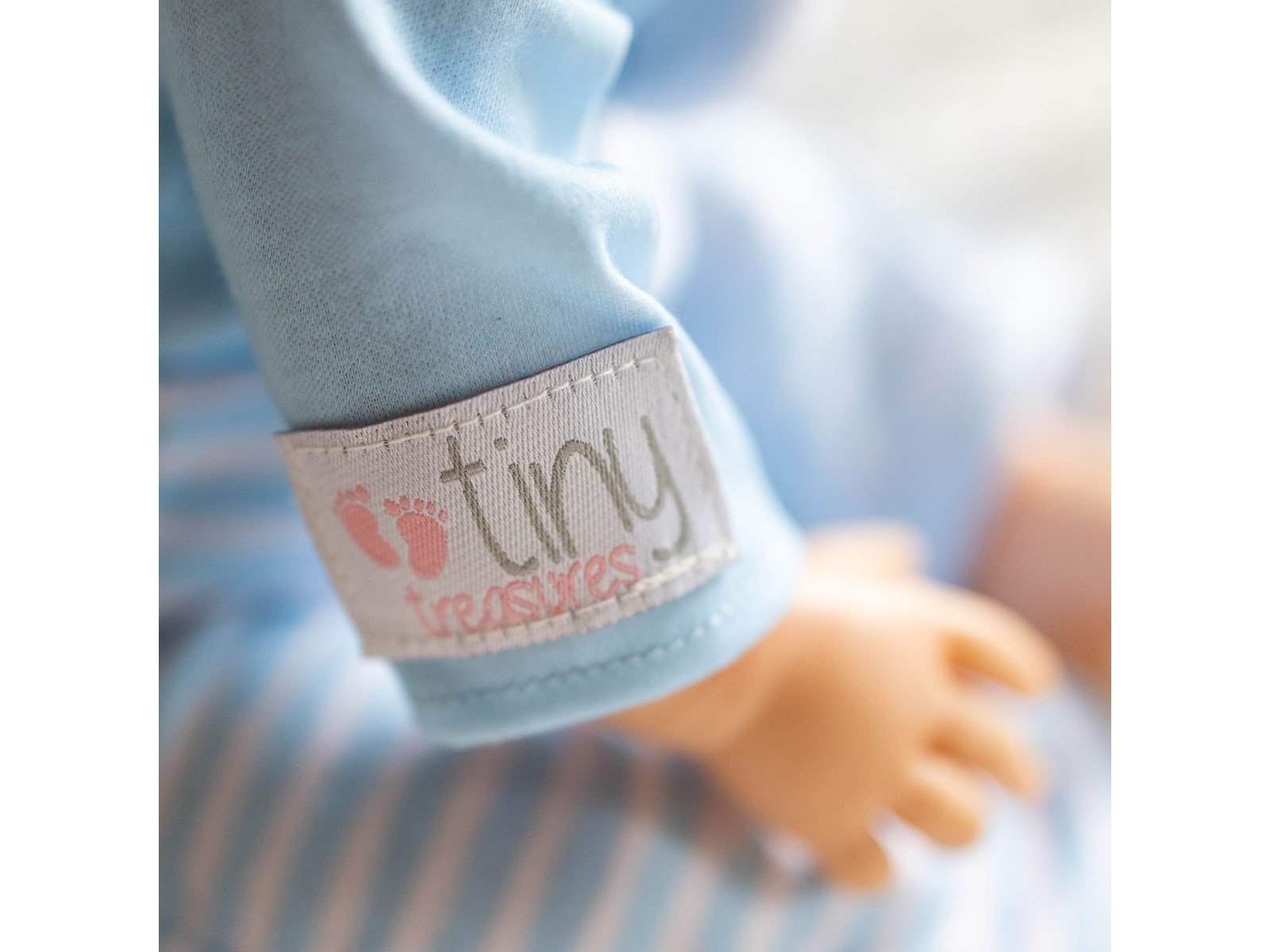 Tiny Treasures Doll with brown hair and blue outfit