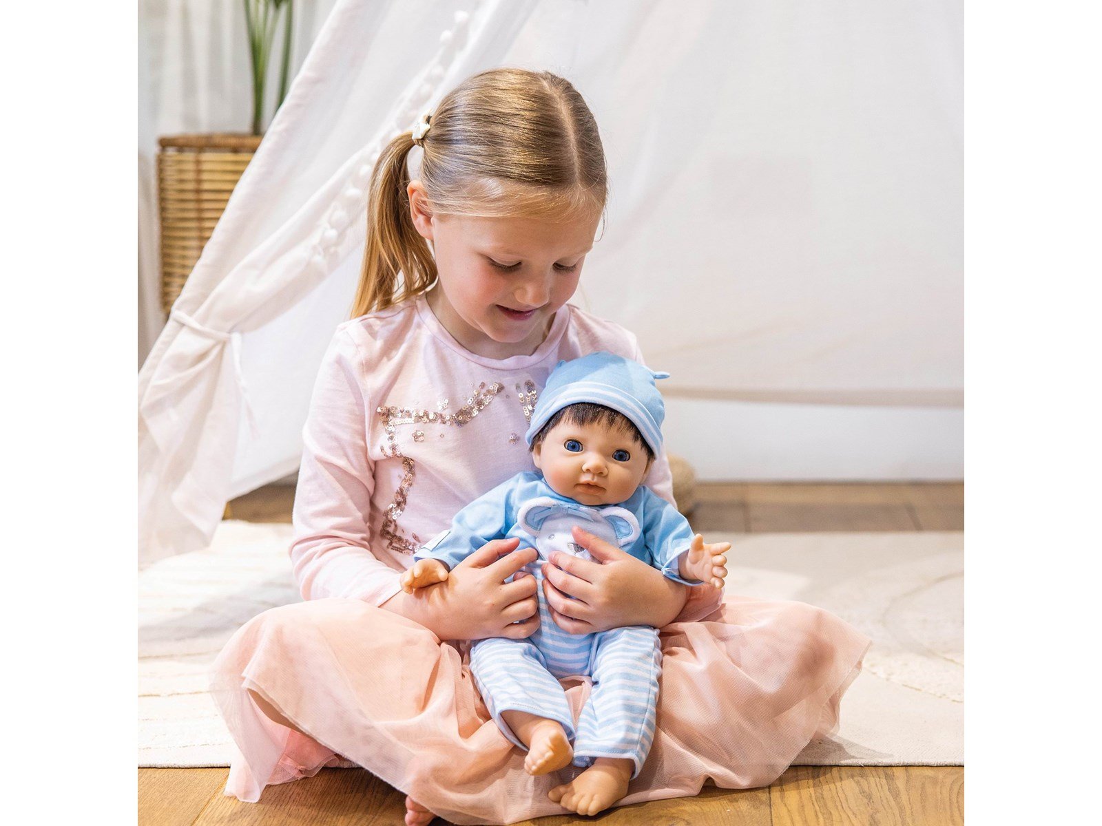 Tiny Treasures Doll with brown hair and blue outfit